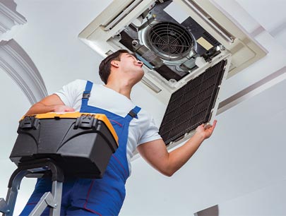 Man Inspecting Inside Hvac System