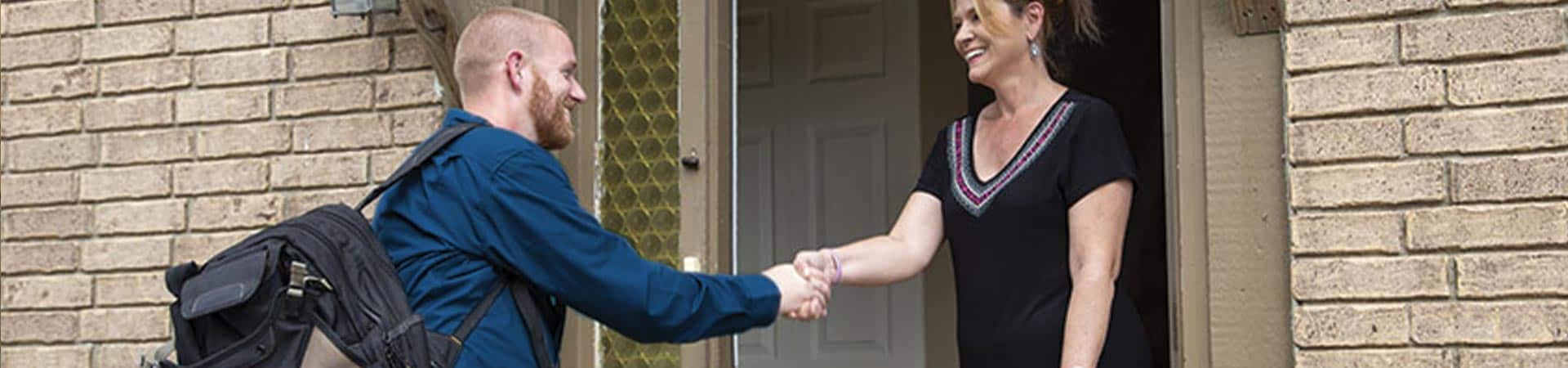 Woman Welcoming Man In Her House