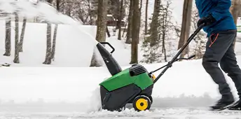 Snowblower In Action Being Pushed After Snowfall